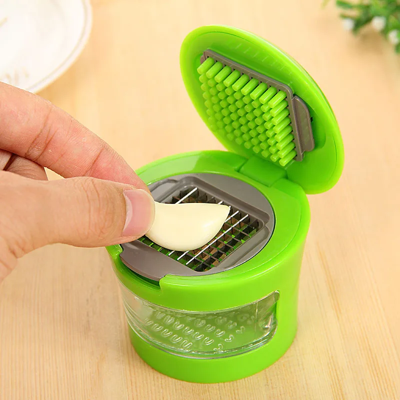 Multi-function garlic press Crusher Grinding machine Mini portable manual garlic crusher Kitchen utensils and accessories
Multi-function garlic press Crusher Grinding machine Mini portable manual garlic crusher Kitchen utensils and accessories