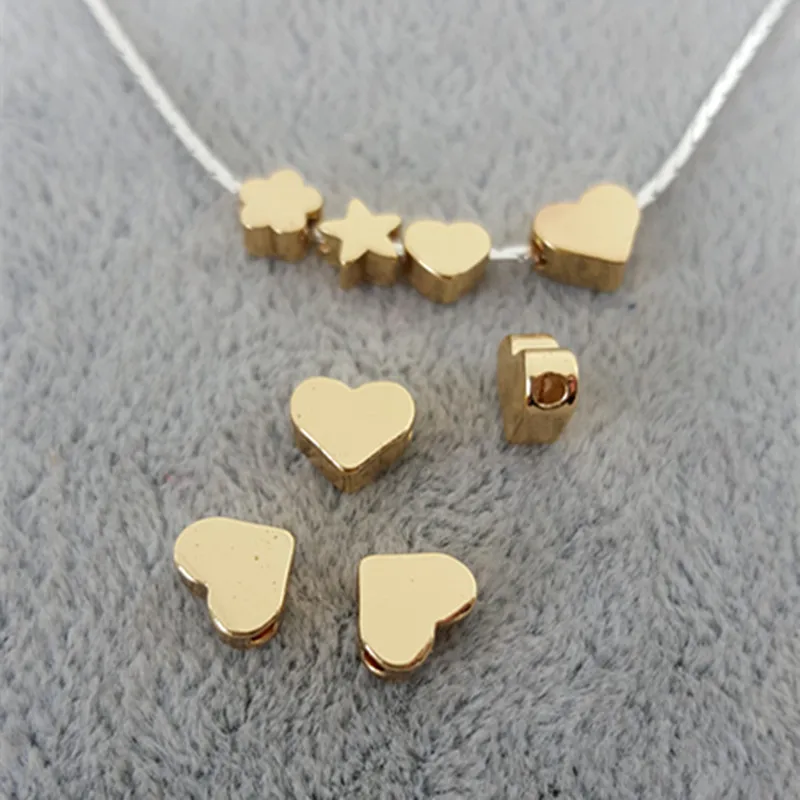 20pcs/lot Metal Charms for Jewelry DIY Making gold heart or star Beads Spacer Bead for necklace
20pcs/lot Metal Charms for Jewelry DIY Making gold heart or star Beads Spacer Bead for necklace