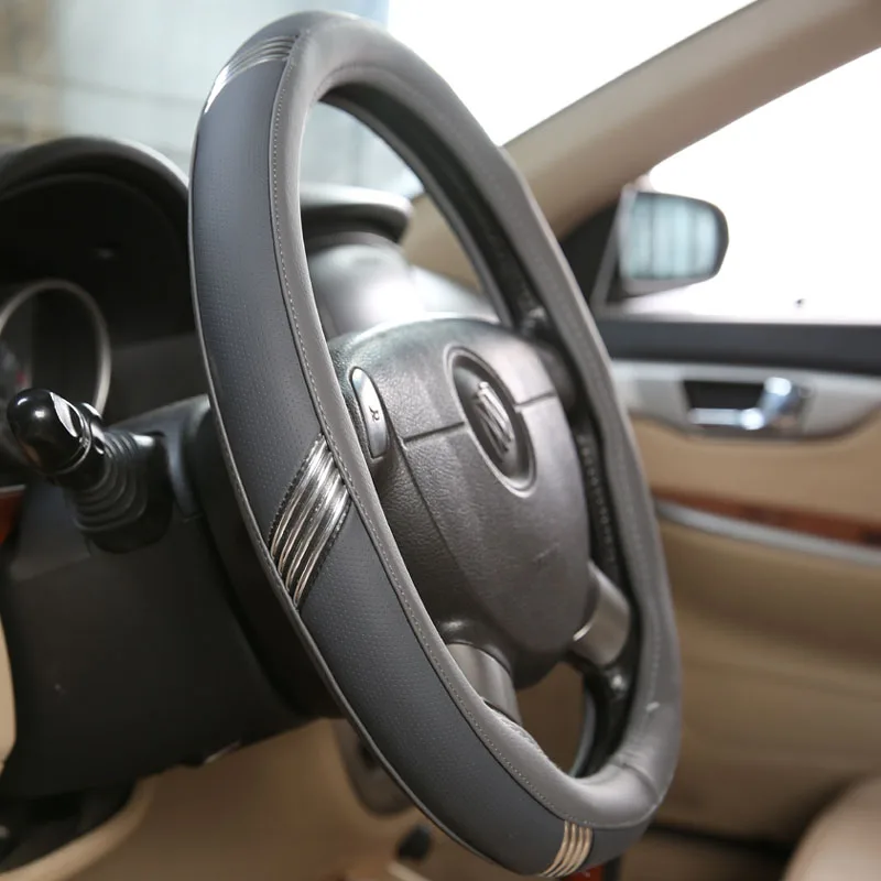 Pu Smooth Leather Silver Strips Steering Wheel Cover Fishtail Perforated Wheel Protector Shell with Natural Rubber Liner F46
Pu Smooth Leather Silver Strips Steering Wheel Cover Fishtail Perforated Wheel Protector Shell with Natural Rubber Liner F46