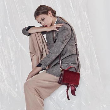 Bag for women Korean version of the simple tide brand suede bow streamers shoulder slung handbag
Bag for women Korean version of the simple tide brand suede bow streamers shoulder slung handbag