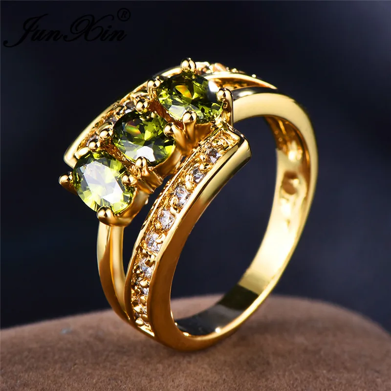 JUNXIN Three Oval Stone Olive Green Zircon Engagement Rings For Women Men Yellow Gold Fillled August Birthstone CZ Female Ring
JUNXIN Three Oval Stone Olive Green Zircon Engagement Rings For Women Men Yellow Gold Fillled August Birthstone CZ Female Ring