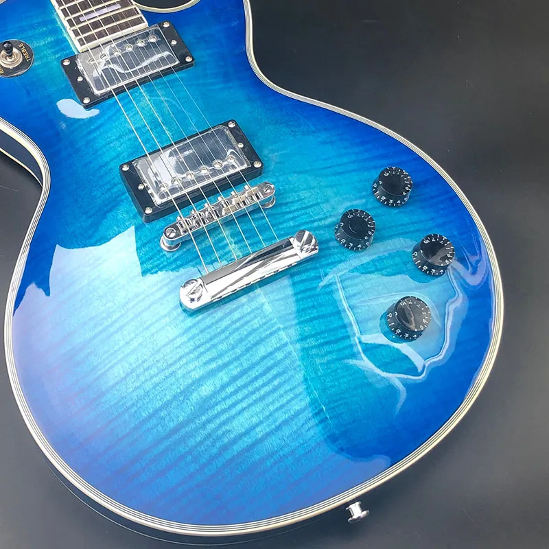 High quality electric guitar. Blue paint, tiger maple veneer, color can be customized, free shipping
High quality electric guitar. Blue paint, tiger maple veneer, color can be customized, free shipping