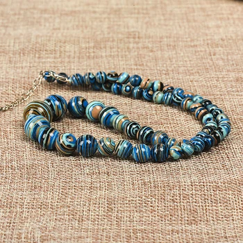 With mixed color stripes of different sizes Blue-veins Turquoise jewelry necklace that is perfect for a woman of spirit
With mixed color stripes of different sizes Blue-veins Turquoise jewelry necklace that is perfect for a woman of spirit
