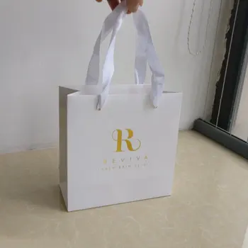 Wholesale 1000pcs/Lot 18x18x8cm Luxury gift clothes white paper shopping bags customized gold foil logo Free shipping
Wholesale 1000pcs/Lot 18x18x8cm Luxury gift clothes white paper shopping bags customized gold foil logo Free shipping
