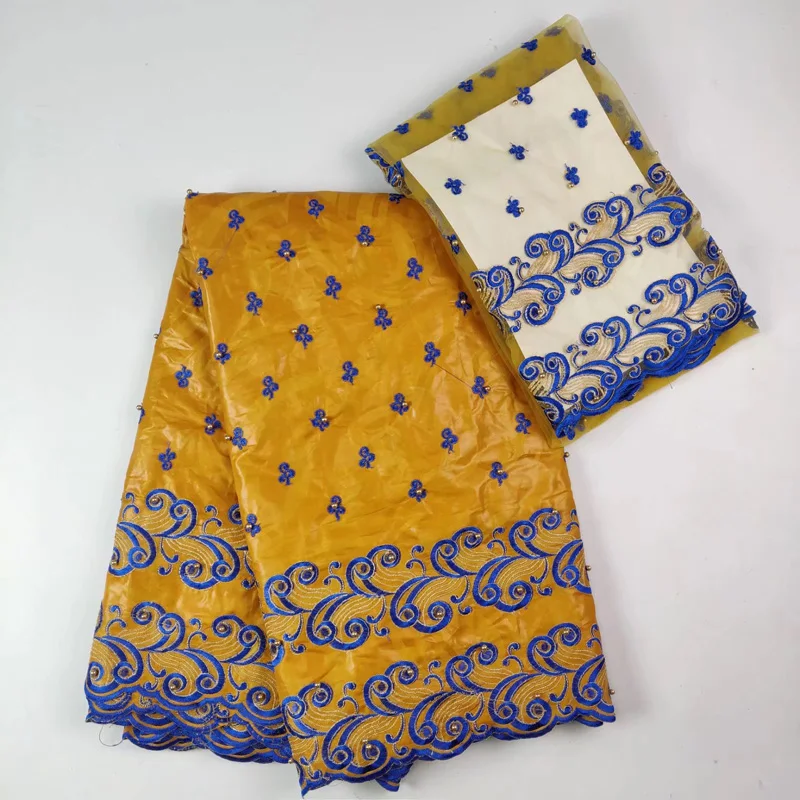(5+2 yards /set) high quality African lace fabric yellow and blue bazin lace fabric with embroidery and beads for dress BLW15
(5+2 yards /set) high quality African lace fabric yellow and blue bazin lace fabric with embroidery and beads for dress BLW15