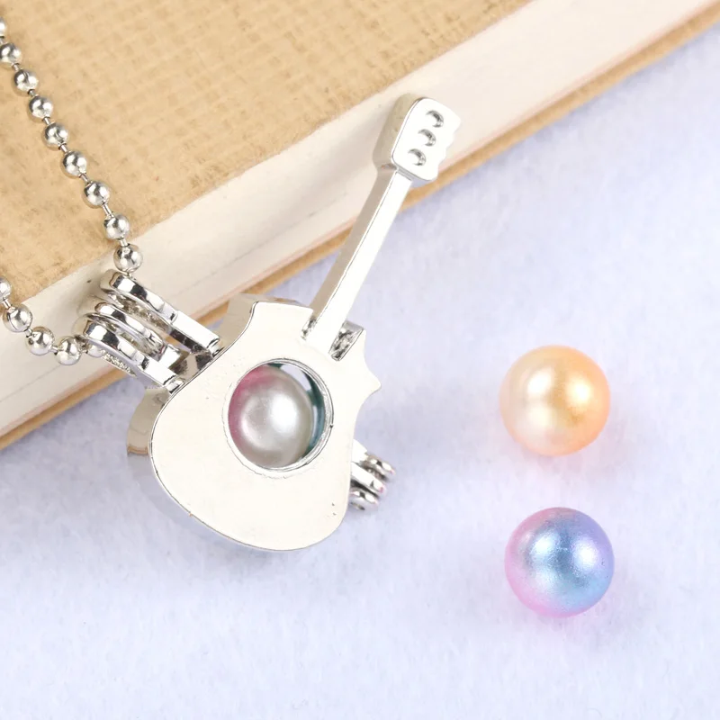 Silver Fashion guitar Pearl Cage Jewelry Making Bead Cage Pendant Essential Oil Diffuser Locket For Oyster Pearl Fun gifts
Silver Fashion guitar Pearl Cage Jewelry Making Bead Cage Pendant Essential Oil Diffuser Locket For Oyster Pearl Fun gifts