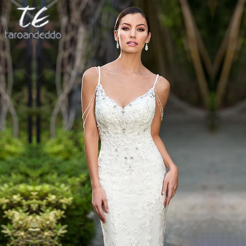 Spaghetti Straps Wedding Dresses Off the Shoulder Crystals Sleeveless Sexy Open Back Tulle Size Illusion Bridal Gown With Button
Spaghetti Straps Wedding Dresses Off the Shoulder Crystals Sleeveless Sexy Open Back Tulle Size Illusion Bridal Gown With Button