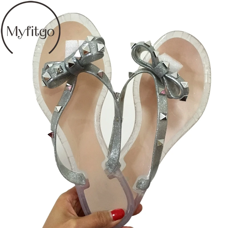 Myfitgo Summer Beach Woman Flip Flops PVC Slides Female Sandals Rivet Bowknot Slip on Flat with Women Studs Slippers Jelly Shoes
Myfitgo Summer Beach Woman Flip Flops PVC Slides Female Sandals Rivet Bowknot Slip on Flat with Women Studs Slippers Jelly Shoes