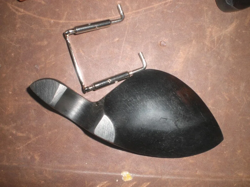 1 PC of Ebony WOOD Violin Chin rest with SILVERcolor Chin rest screw all in 4/4 without chin rest holes
1 PC of Ebony WOOD Violin Chin rest with SILVERcolor Chin rest screw all in 4/4 without chin rest holes