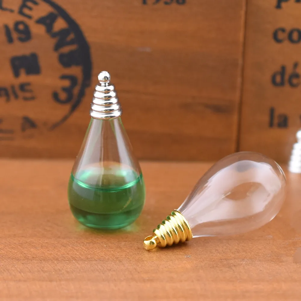 1set hollow glass drop vase with cap set glass vials pendant glass bottle jewelry pendant globe jewelry findings
1set hollow glass drop vase with cap set glass vials pendant glass bottle jewelry pendant globe jewelry findings