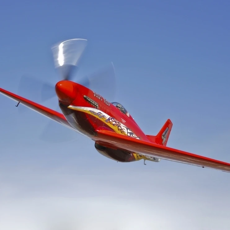 A Dago Red P-51G Mustang in flight Poster Print (16 x 12)
