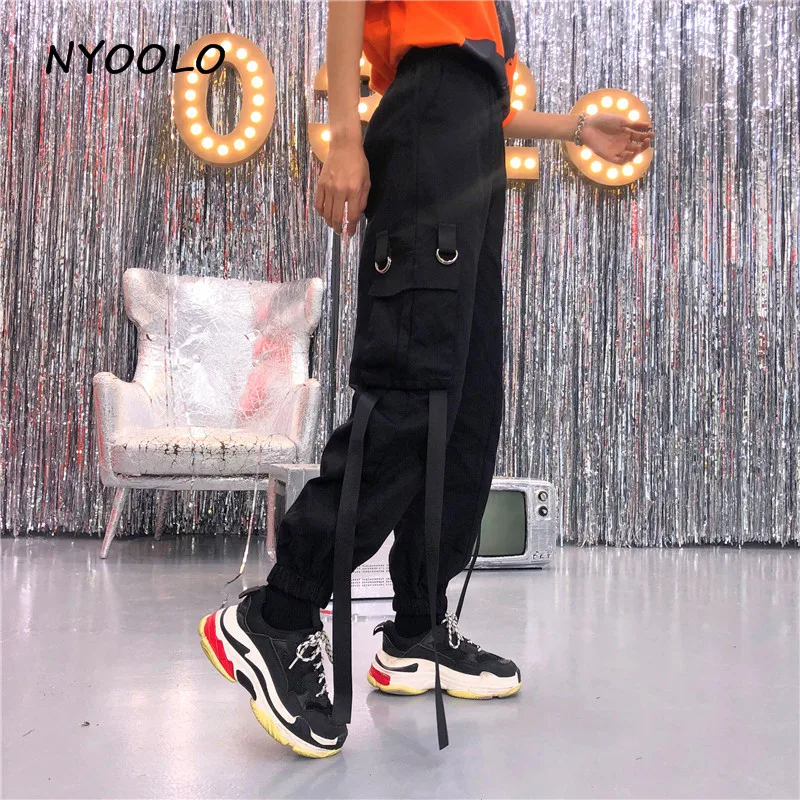 NYOOLO Autumn high waist big pockets Ribbon overalls Safari style streetwear elastic waist hip hop cargo pants women men
NYOOLO Autumn high waist big pockets Ribbon overalls Safari style streetwear elastic waist hip hop cargo pants women men