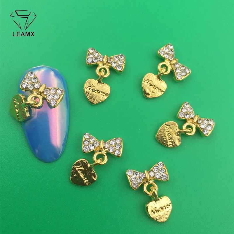 LEAMX 10 PCS/bag AB/Clear Rhinestones Nails Art Decorations 3D Bow With Heart Nail DIY Manicure Alloy Nail Charms Supply L414
LEAMX 10 PCS/bag AB/Clear Rhinestones Nails Art Decorations 3D Bow With Heart Nail DIY Manicure Alloy Nail Charms Supply L414