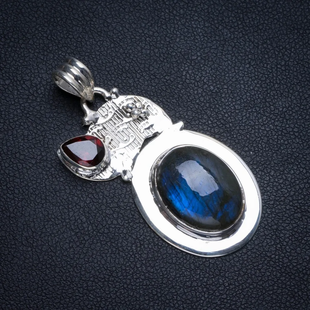 Natural Blue Fire Labradorite and Garnet 925 Sterling Silver Pendant 1 3/4" T1075
Natural Blue Fire Labradorite and Garnet 925 Sterling Silver Pendant 1 3/4" T1075