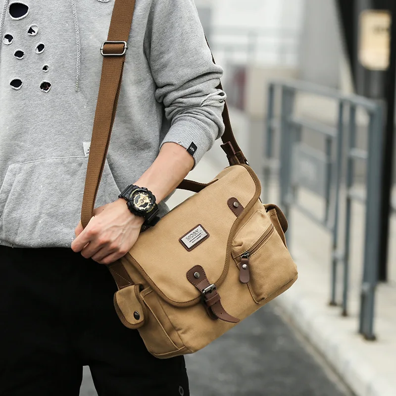 Leisure men's backpack single-shoulder canvas bag Korean version of the trend business slant handbag
Leisure men's backpack single-shoulder canvas bag Korean version of the trend business slant handbag