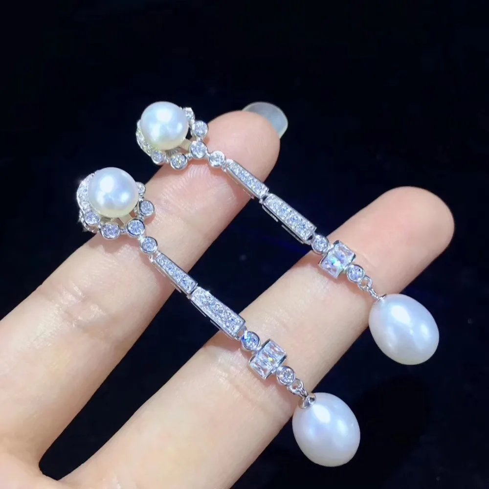 Серьги из серебра длинные висячие серьги пробы с натуральным пресноводным жемчугом и фианитами
Серьги из серебра длинные висячие серьги пробы с натуральным пресноводным жемчугом и фианитами