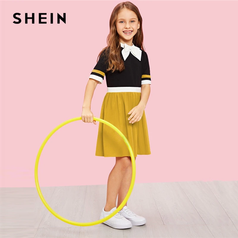 SHEIN Kiddie Girls Stand Collar Bow Front Striped Cuff Colorblock Casual Dress 2019 Summer Sort Sleeve Kid A Line Preppy Dresses
SHEIN Kiddie Girls Stand Collar Bow Front Striped Cuff Colorblock Casual Dress 2019 Summer Sort Sleeve Kid A Line Preppy Dresses