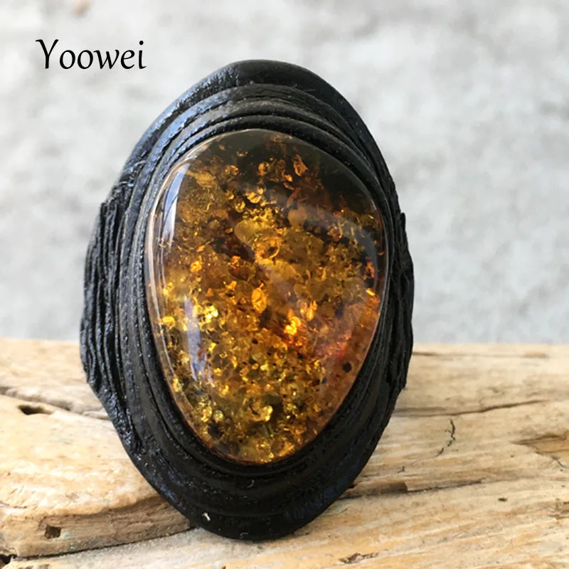 

Yoowei Oval Amber Rings for Unisex Cool Gift Trendy Black Genuine Leather Flower Natural Amber Jewelry Opening Rings Wholesale