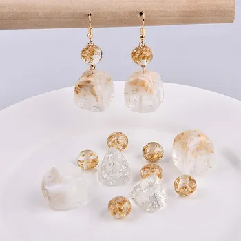 DIY earring accessories resin inlaid with gold and silver foil triangular-shaped beads earrings pendant material pendant.
DIY earring accessories resin inlaid with gold and silver foil triangular-shaped beads earrings pendant material pendant.