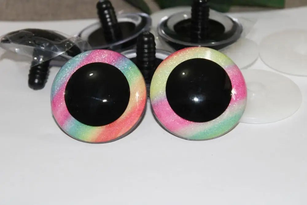 

1pair-- 30mm/40mm/50mm round clear safety toy eyes +glitter rainbow fabric+hard washer for diy doll findings--color by randomly