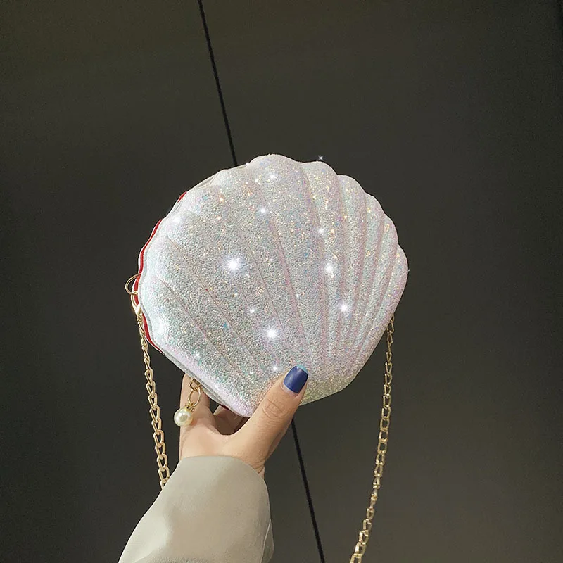 Women Summer Diamond Shell Shoulder Bag Beach Chain Pearl Crossbody Bag Luxury Party Sequin Evening Bag New Glittered Day Clutch
Women Summer Diamond Shell Shoulder Bag Beach Chain Pearl Crossbody Bag Luxury Party Sequin Evening Bag New Glittered Day Clutch