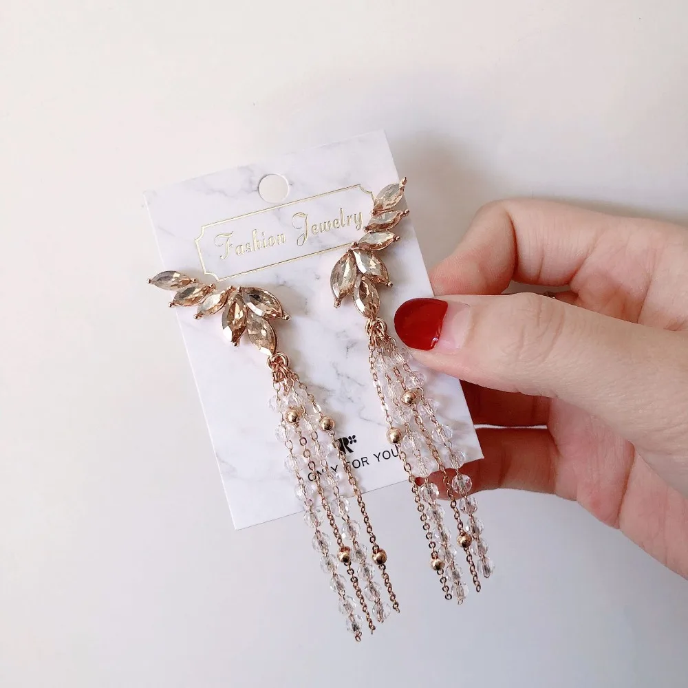 Rongho Crystal wing earrings for women bridal brincos beads chain Tassel earring pendant femme statement earring
Rongho Crystal wing earrings for women bridal brincos beads chain Tassel earring pendant femme statement earring