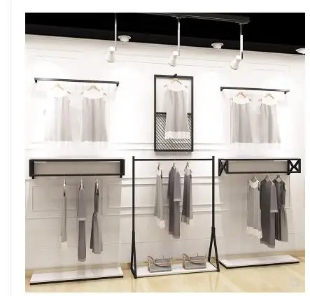 Retro clothing store display stand floor type men and women clothing display rack solid wood shelf hanging clothes shelf .
Retro clothing store display stand floor type men and women clothing display rack solid wood shelf hanging clothes shelf .