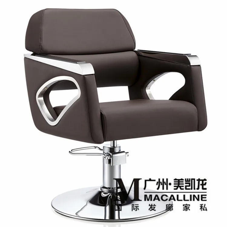 Image European hairdressing chair solid wood cutting. Luxury Italian hair salon chair. The new barber s chair