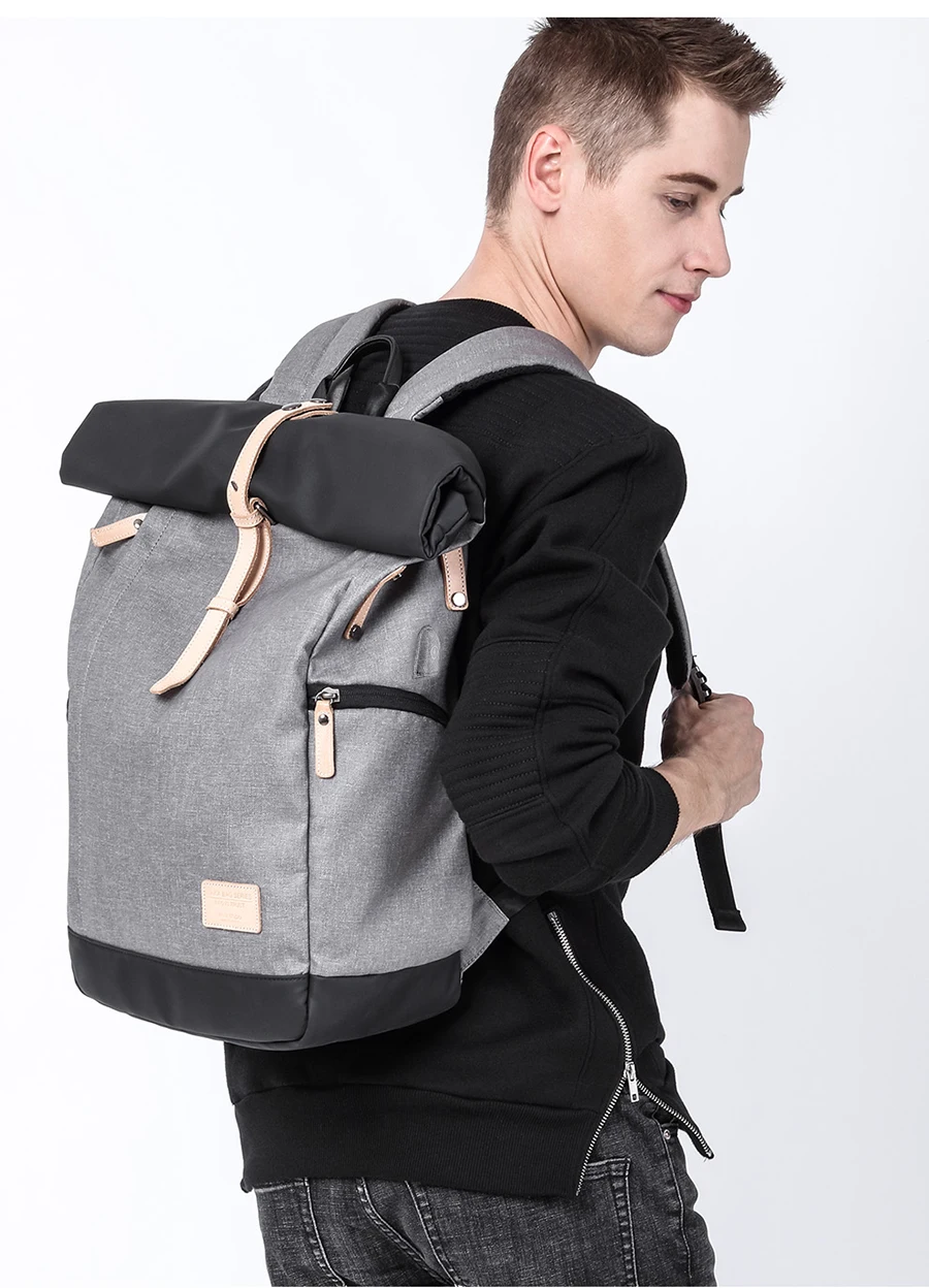 a guy carrying a rucksack on his shoulders like a backpack