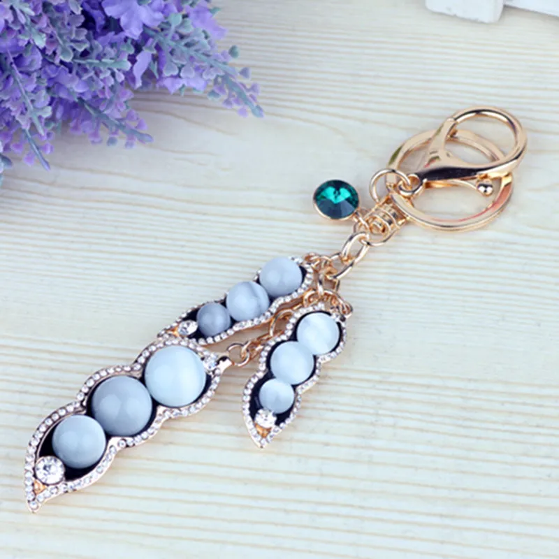 Fashion crystal cat-eye peas female bags pendant keychain accessories male auto key ring cuff links
Fashion crystal cat-eye peas female bags pendant keychain accessories male auto key ring cuff links
