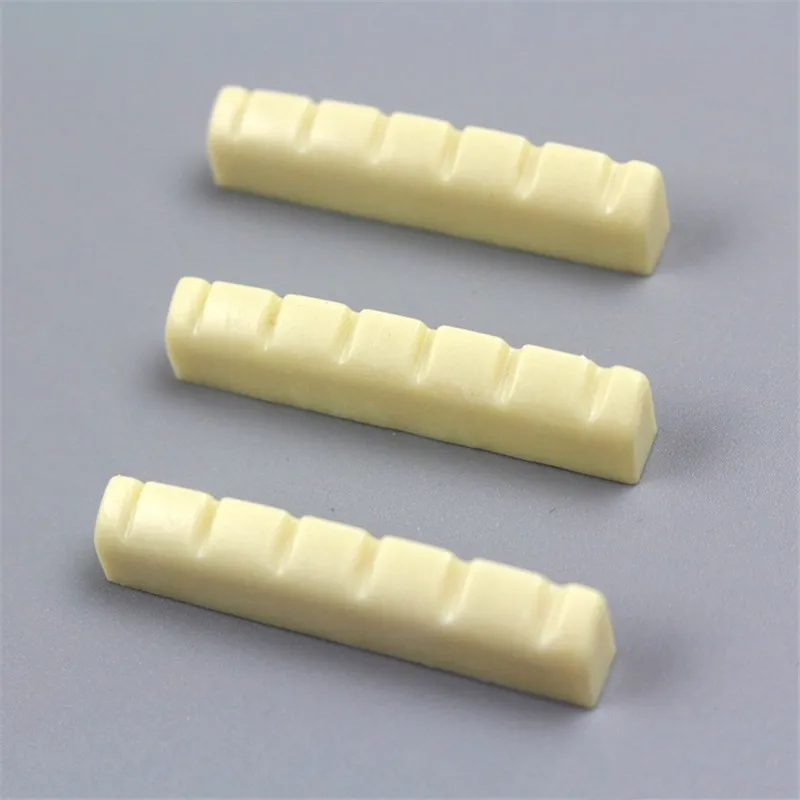 1 Pcs Folk guitar strings pillow bottom chord pillow String bridge pass White black Guitar accessories
1 Pcs Folk guitar strings pillow bottom chord pillow String bridge pass White black Guitar accessories