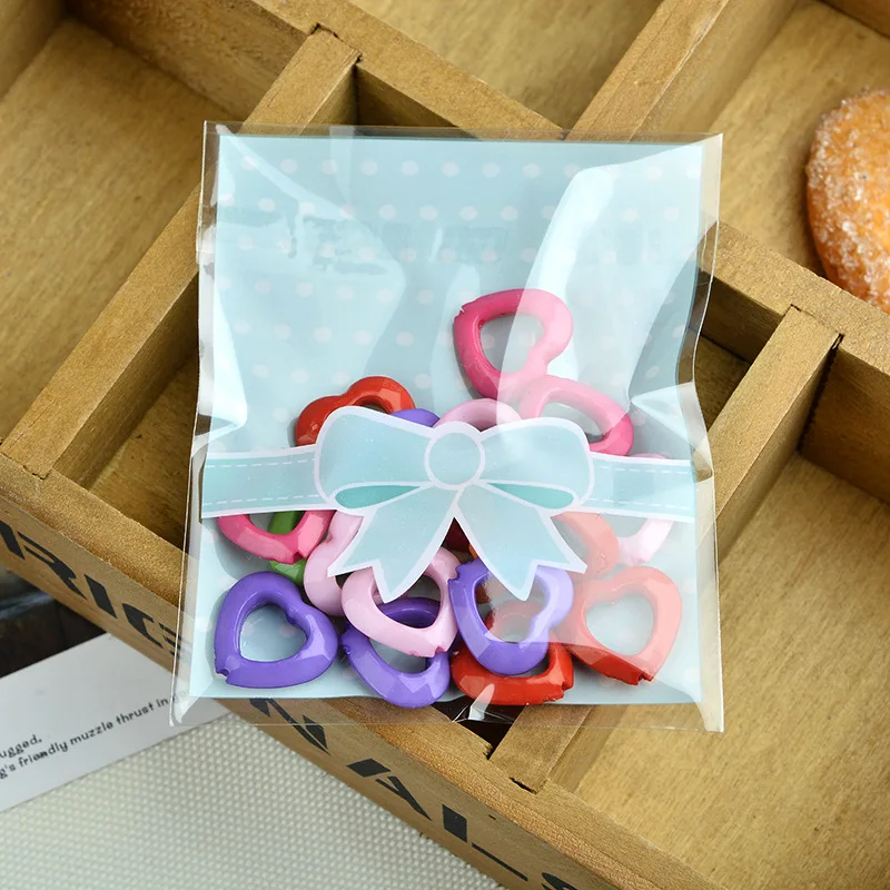 50/100Pcs/Pack 10*10+3cm Candy Cookie Bowknot Flower Printed Plastic Bags Self Adhesive Gift Bag Wedding Party Favors Packaging
50/100Pcs/Pack 10*10+3cm Candy Cookie Bowknot Flower Printed Plastic Bags Self Adhesive Gift Bag Wedding Party Favors Packaging