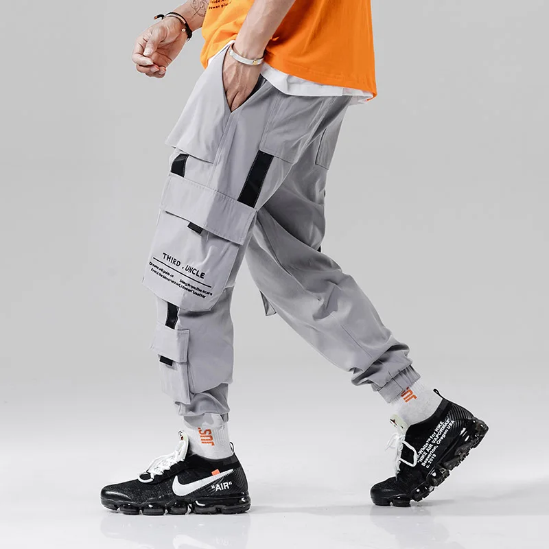 Drop Shipping New High Quality Street Men Cargo Style Jogger Harem Pants Casual Autumn Male Ribbon Printed Full Length Trousers
Drop Shipping New High Quality Street Men Cargo Style Jogger Harem Pants Casual Autumn Male Ribbon Printed Full Length Trousers