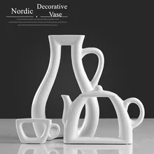 Elegant Creative Abstract Ceramic White Vase Teapot Cup Shaped Decorative Porcelain Tabletop Vase Ornament Accessories Crafts
Elegant Creative Abstract Ceramic White Vase Teapot Cup Shaped Decorative Porcelain Tabletop Vase Ornament Accessories Crafts