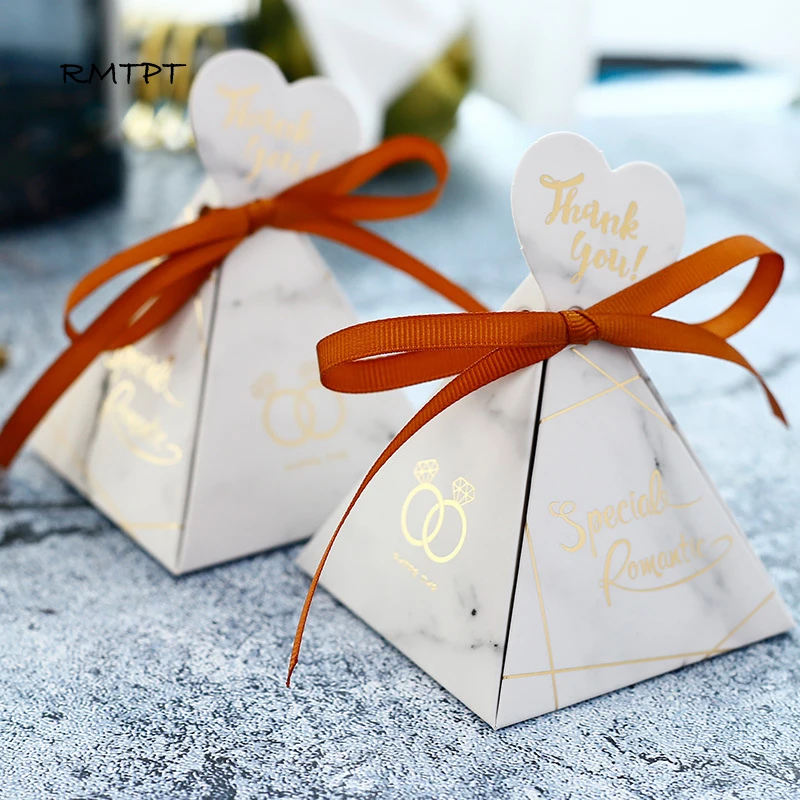 RMTPT Marble style gift box wedding favors and gifts Triangular Pyramid candy box wedding gifts for guests wedding decoration
RMTPT Marble style gift box wedding favors and gifts Triangular Pyramid candy box wedding gifts for guests wedding decoration