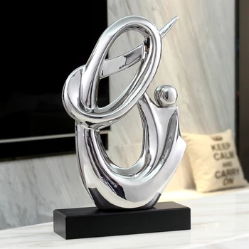 Modern Creative Silver Abstract Twisted Ring Statue Home Decor Crafts Room Decoration Objects Office Ceramic Figurines Wood Base
Modern Creative Silver Abstract Twisted Ring Statue Home Decor Crafts Room Decoration Objects Office Ceramic Figurines Wood Base