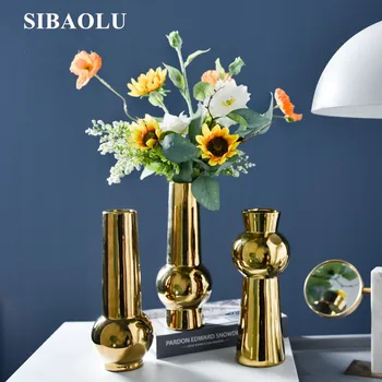 Europe Style Gold Ceramic Vases Simple Living Room Bedroom Vase Table Flower Arrangement Ornaments Small Gold Vase for Wedding
Europe Style Gold Ceramic Vases Simple Living Room Bedroom Vase Table Flower Arrangement Ornaments Small Gold Vase for Wedding