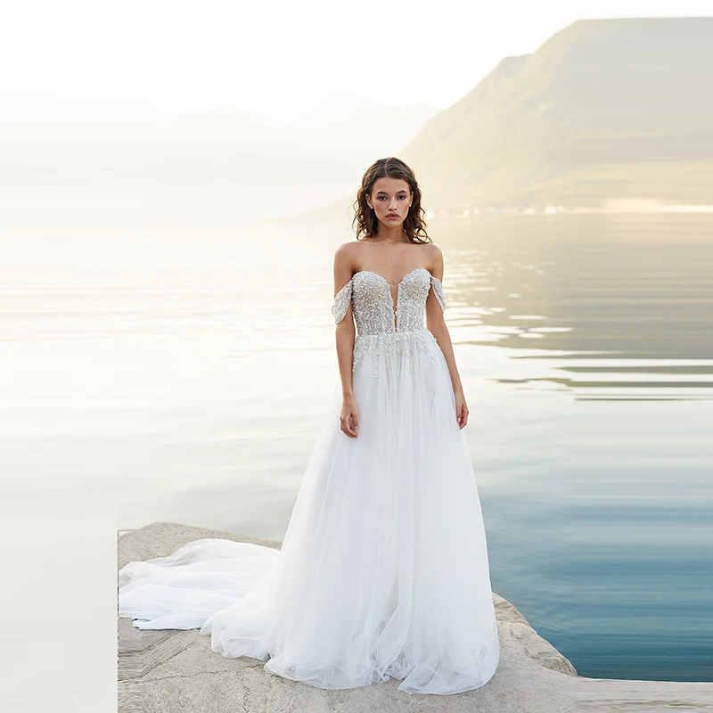 Modern Summer A Line Back Out Bride Wedding Dresses Sweetheart Off Shoulder Sleeves Beading Bridal Gowns Court Train Wholesale
Modern Summer A Line Back Out Bride Wedding Dresses Sweetheart Off Shoulder Sleeves Beading Bridal Gowns Court Train Wholesale