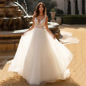 Sexy V-Neck Lace Appliques Top A-Line Wedding Dresses Backless Tulle Skirt Sleeveless Bridal Gowns Simple Fashionable Vestidos
Sexy V-Neck Lace Appliques Top A-Line Wedding Dresses Backless Tulle Skirt Sleeveless Bridal Gowns Simple Fashionable Vestidos