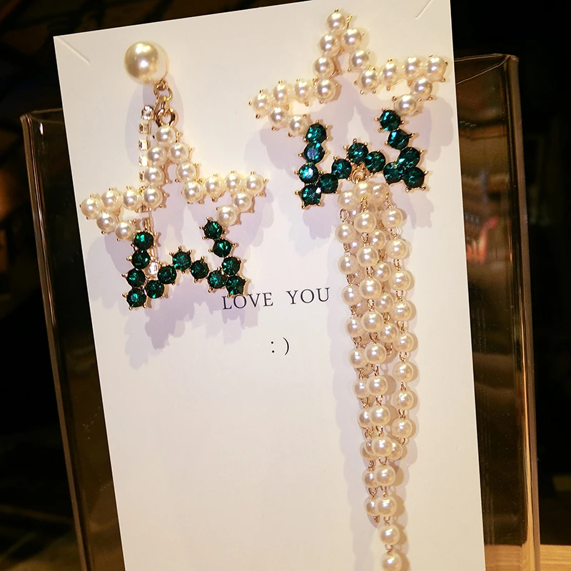 Xinwei Wholesale 2018 asymmetric AB version of the new exaggerated pearl five-pointed star tassel long earrings
Xinwei Wholesale 2018 asymmetric AB version of the new exaggerated pearl five-pointed star tassel long earrings