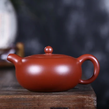 Yixing recommended full manual undressed ore mud flat round dahongpao zhu bead capacity of 360 ml new tea set
Yixing recommended full manual undressed ore mud flat round dahongpao zhu bead capacity of 360 ml new tea set