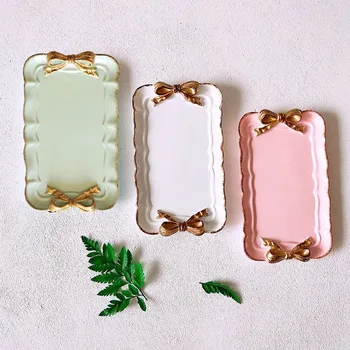 European Style Bow Cake Storage Trays Makeup Organizer Dessert Plate Square Decor Tray Kitchen Storage Trays 12x20Cm
European Style Bow Cake Storage Trays Makeup Organizer Dessert Plate Square Decor Tray Kitchen Storage Trays 12x20Cm
