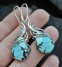 

Texturized silver teardrop hoop with Turquoise gemstone, December birthstone earrings