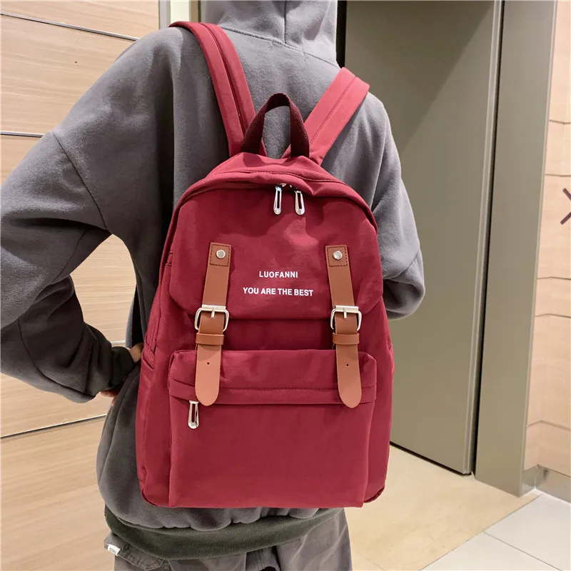 Фото DCIMOR Waterproof nylon Women Backpack Female Belt buckle leisure back pack Schoolbag for Teenage girls Travel Bag Book Mochila | Багаж и