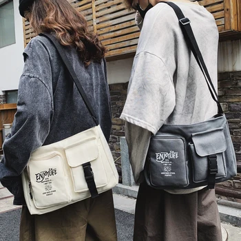 Bungee shoulder bag men and women couples neutral backpack Han Chao cool canvas bag college students leisure diagonal bag 
Bungee shoulder bag men and women couples neutral backpack Han Chao cool canvas bag college students leisure diagonal bag