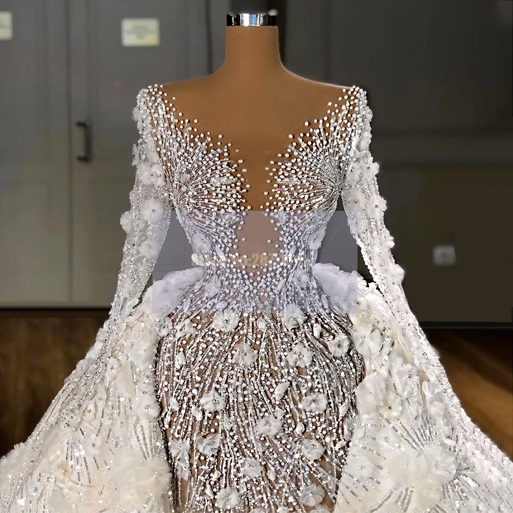 Роскошное арабское свадебное платье с иллюзией, Русалка длиной до пола, длинные рукава, аппликации с бисером и блестками, съемный шлейф, свадебное платье
Роскошное арабское свадебное платье с иллюзией, Русалка длиной до пола, длинные рукава, аппликации с бисером и блестками, съемный шлейф, свадебное платье