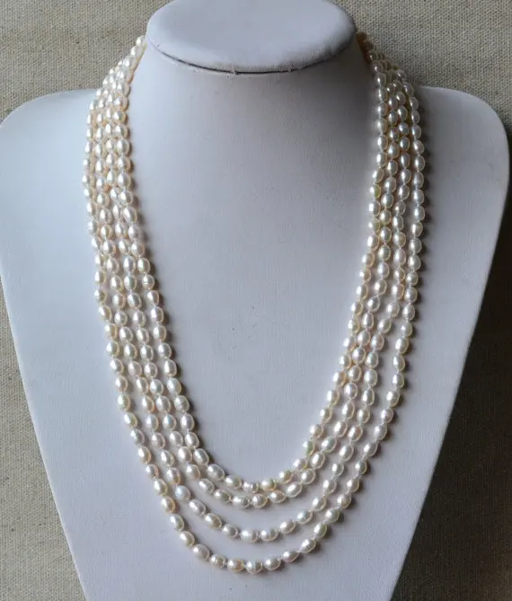 New Classic Handmade Long Pearl Necklace 100 inches White AA 6-7MM Real Freshwater Pearl Rice Beaded Necklace Party Women Gift 
New Classic Handmade Long Pearl Necklace 100 inches White AA 6-7MM Real Freshwater Pearl Rice Beaded Necklace Party Women Gift