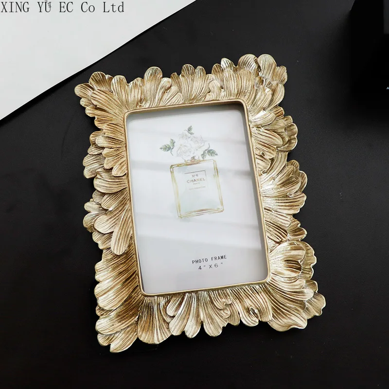 Nordic Simple Golden Resin Feather Photo Frame Decoration 6-inch Photo Setting Table Home Picture Frame Light Luxury Decoration
Nordic Simple Golden Resin Feather Photo Frame Decoration 6-inch Photo Setting Table Home Picture Frame Light Luxury Decoration
