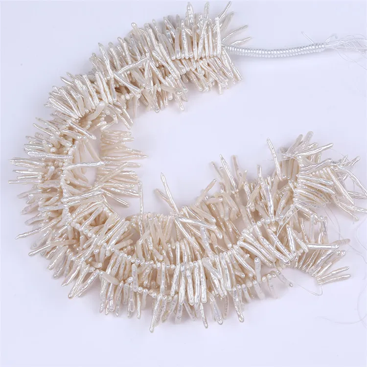 

The factory price 20mm biwa freshwater toothpick shape pearl strands thin baroque pearls string