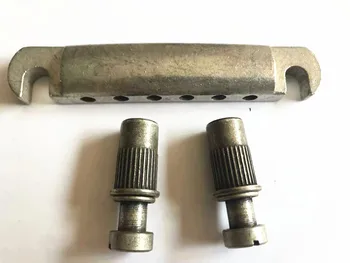 Guitar Stop Bar Tailpiece with Anchors And Studs Bronze color for LP SG Guitars
Guitar Stop Bar Tailpiece with Anchors And Studs Bronze color for LP SG Guitars